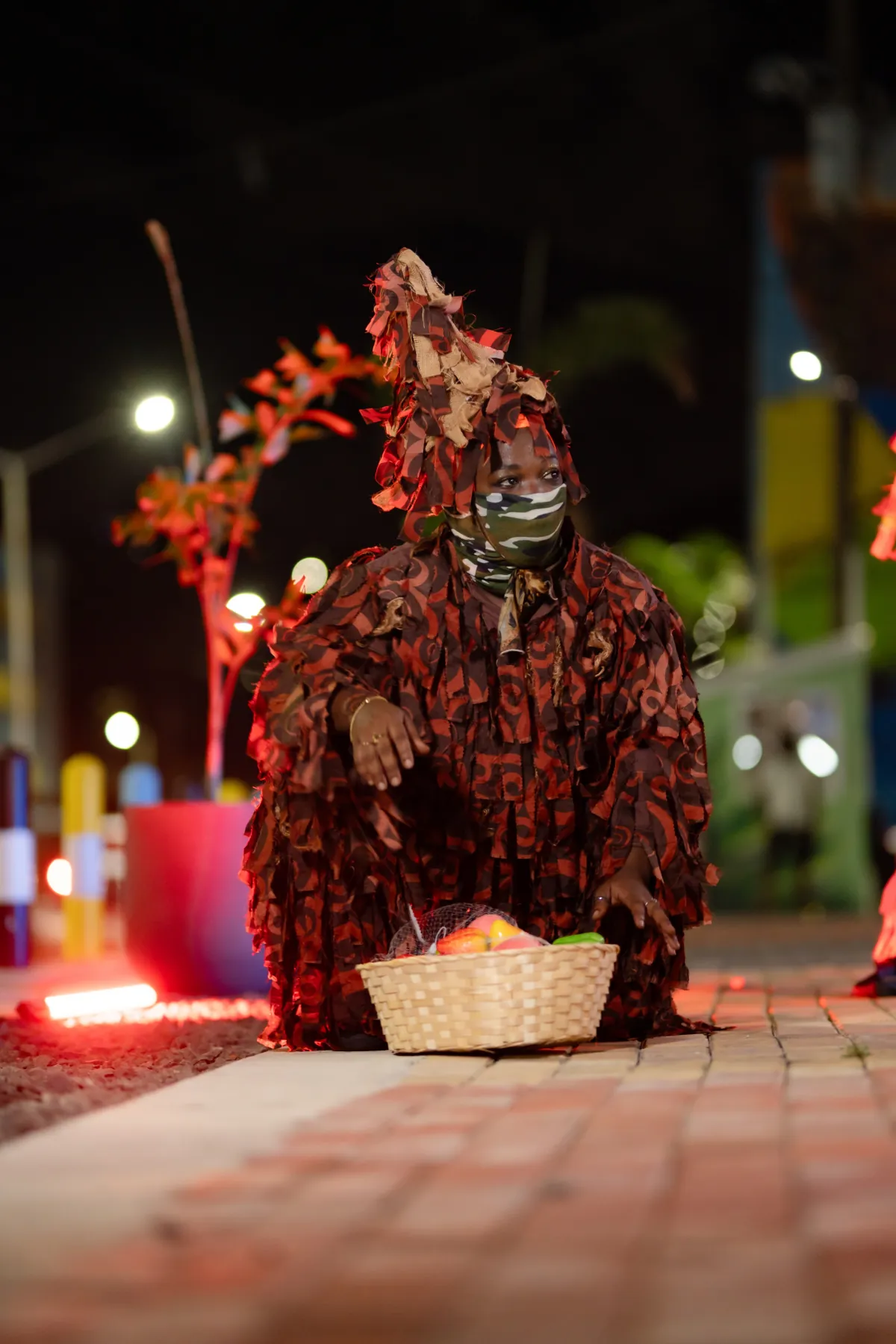 Caribbean dance masquerade performer in a vibrant traditional costume