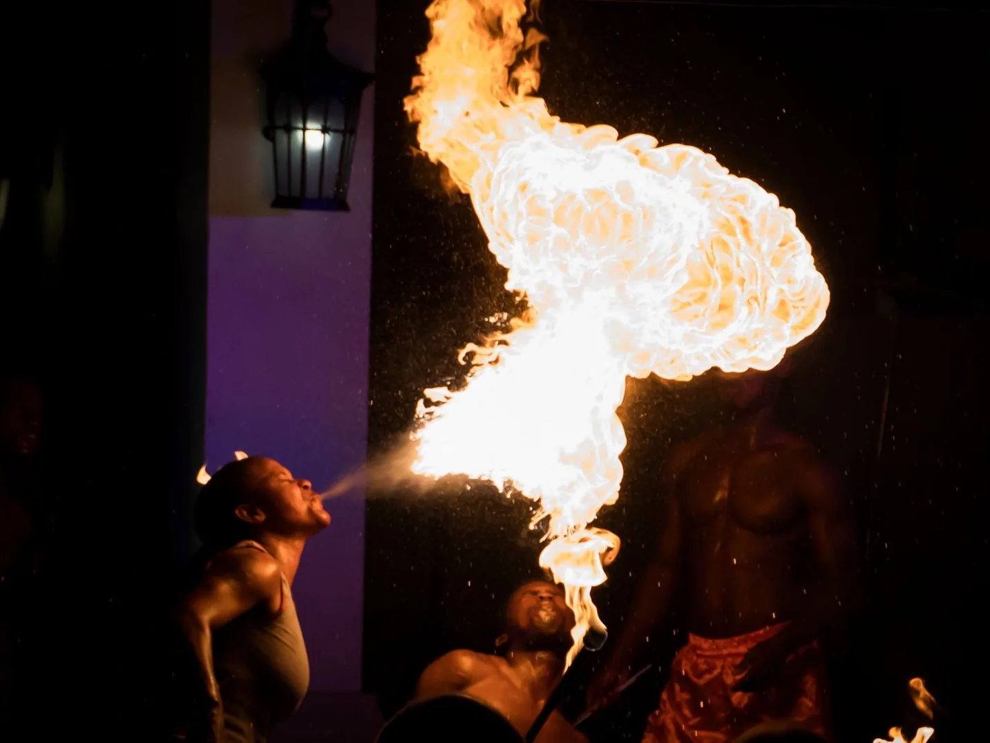 Fire breather creating a dramatic flame plume