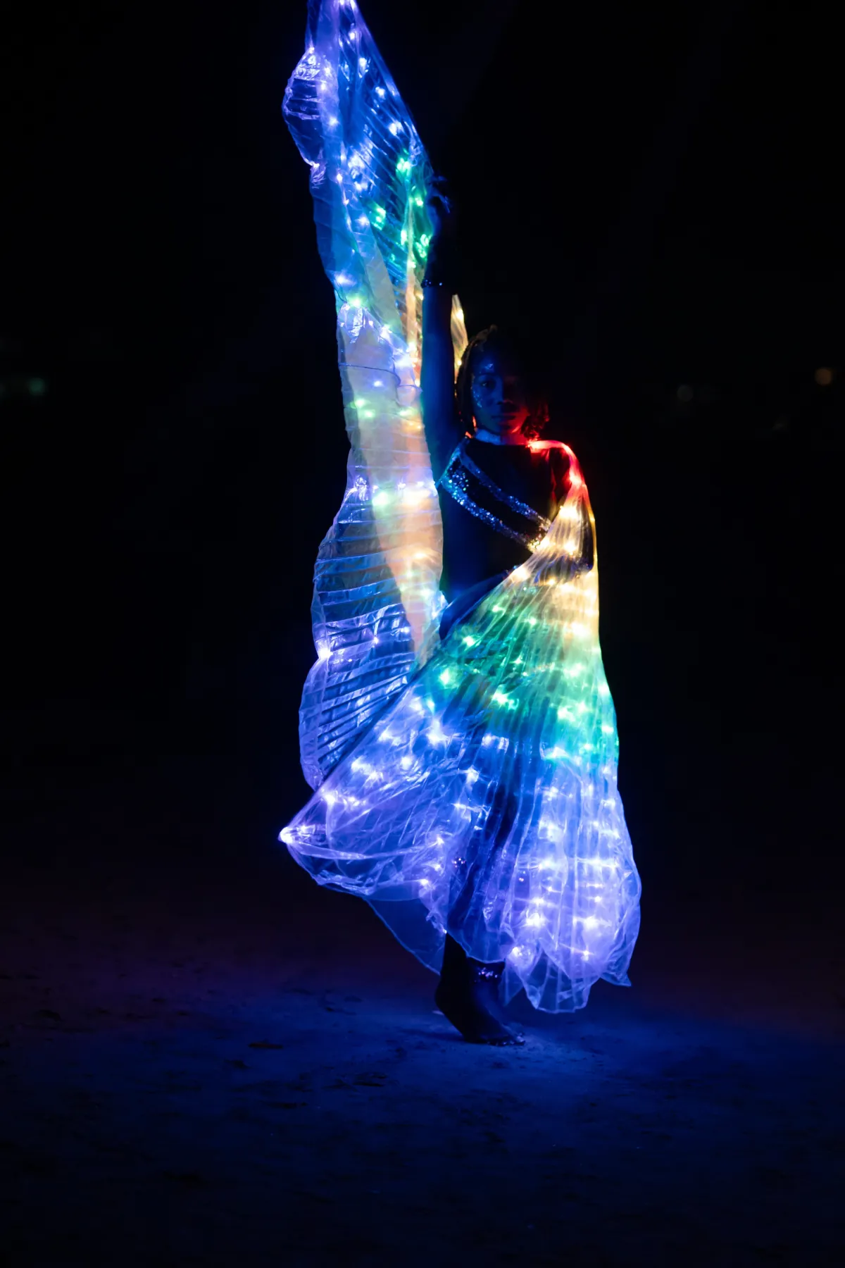 LED-costumed Stars Inc SLU performer with glowing colour effects